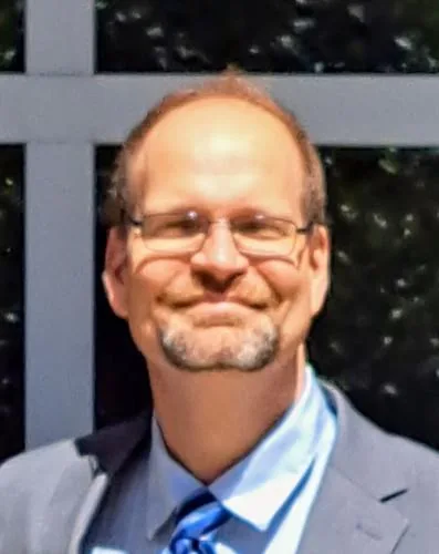 Mitchell R.